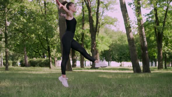 Woman Gymnast in a Jump