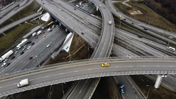 Aerial Drone Flight Over Road Traffic Moving Taxi on The Road Junction