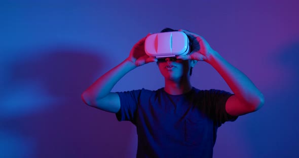 Man looking though VR device