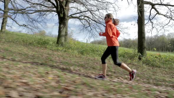 Woman Running Over Meadow