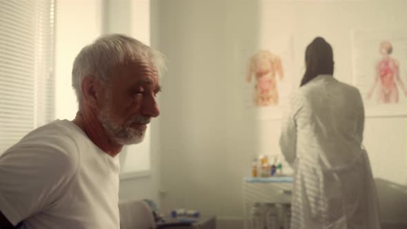 Senior Patient Preparing Get Injection Vaccine in Doctor Office Close Up