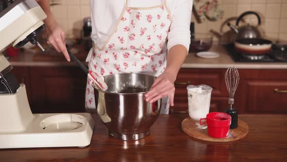 Close Up Shot of the Chef's , Who Mixes the Cream with a Spatula in a Large Bowl