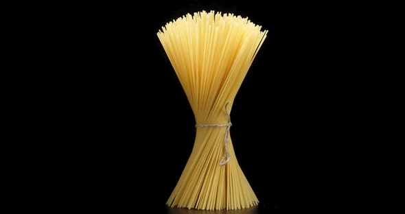 Bunch of Spaghetti Pasta Dry with String Rotates Slowly