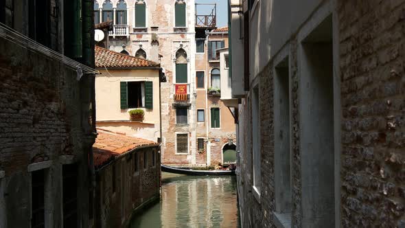 Gondola in a canal in Venice 