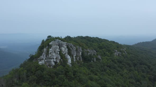 An aerial shot (dolly in) of Big Schloss and Great North Mountain in the evening in the summer, loca