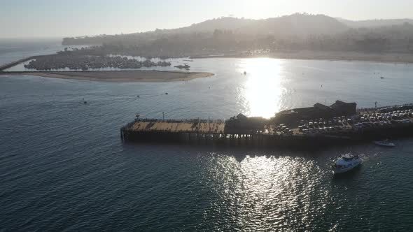 Panoramic View of Stearns Wharf with the Silhouette of a Mountain in the Background in Santa Barbara