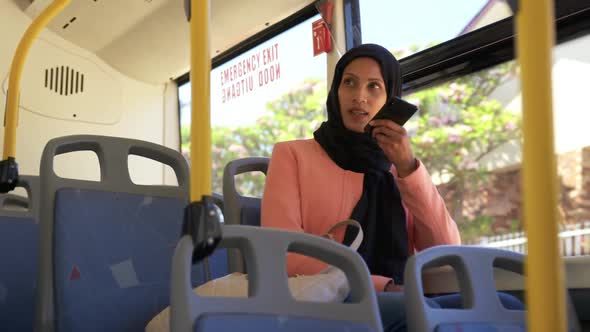 Young woman wearing hijab out and about in the city