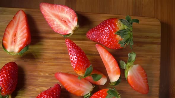 Top View of a Strawberry Quarters Fall on a Board