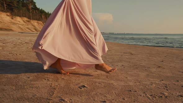 Tender Young Woman Walking Towards Water Holding Her Dress  Sunset Evening Beach ORBIT Footage