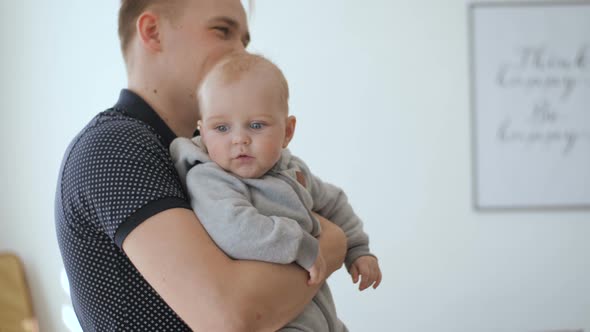 Baby Boy In Father Hands alt