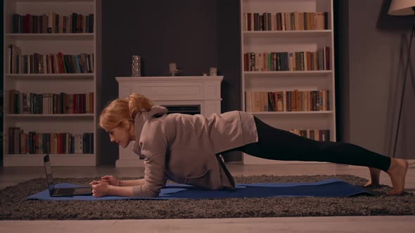 Blonde Doing Workout with Coach Remote