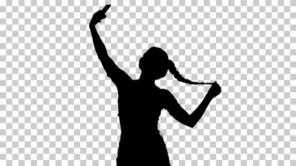 Silhouette girl takes a selfie and dances, Alpha Channel