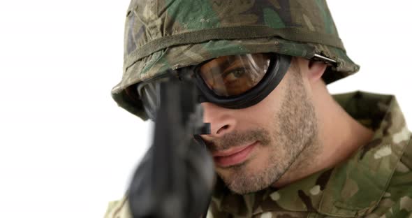 Soldier aiming rifle on white background