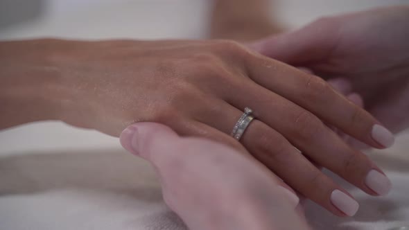 Manicurist Gives Hand Massage to Client