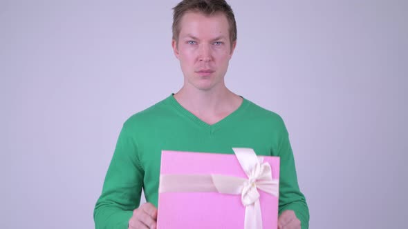 Happy Young Handsome Man with Gift Box Ready for Valentine's Day