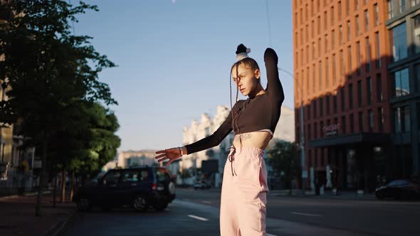 Young Professional Lady Dancer Performs Hiphop on City Road