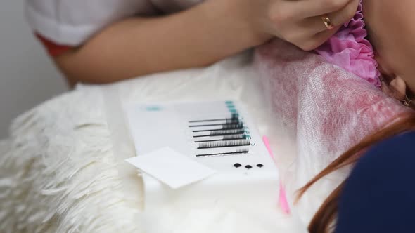 Professional Beautician Undergoing Eyelash Extension Procedure