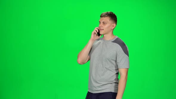 Smiling Guy Goes and Talks on the Phone, Chroma Key. Slow Motion