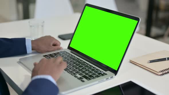 Businessman Using Laptop with Green Chroma Key Screen