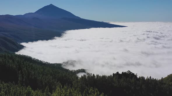 Aerial shot of a view from Pico de Teide on Canary Islands during a heavy cloud inversion below the