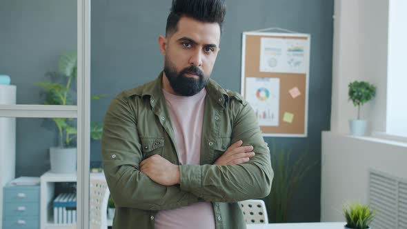 Slow Motion Portrait of Handsome Middle Eastern Guy Office Worker Looking at Camera