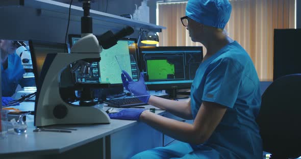 Scientist Using Transparent Display Screen