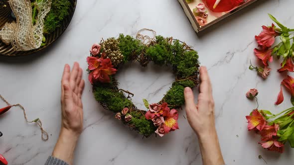 Hands Decorates Diy Floral Wreath for Valentines Day