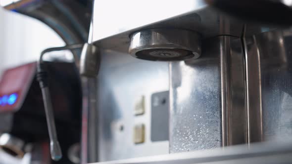 Closeup Cleaning of Espresso Machine in Cafeteria Indoors