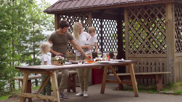 Family Preparing for Picnic on Summer Day