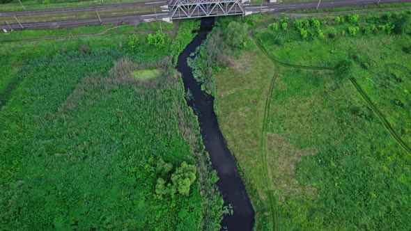 Railway Bridge in Countryside Passing Above Small River