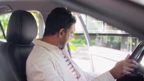 Smiling Indian Man or Driver Driving Car