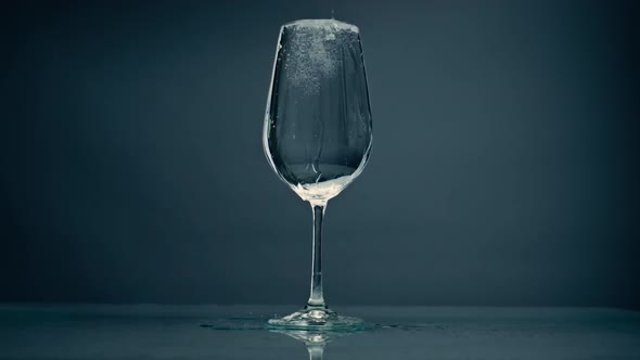 Pure Water Overflowing Glass Closeup