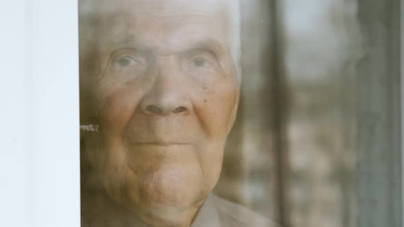Old senior man 90 years old, staying home at quarantine during coronavirus	