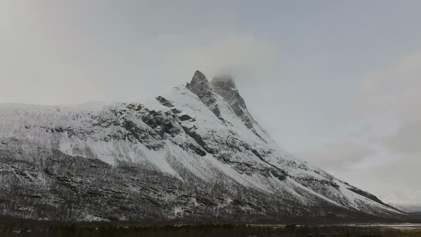 Rugged beauty of snowy mountain landscape of Otertinden, Signaldalen; drone