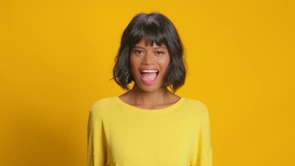 Emotive Young Woman Surprise Raises Hands Hear Great News Over Yellow Background