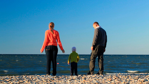 Young Family At the Seaside