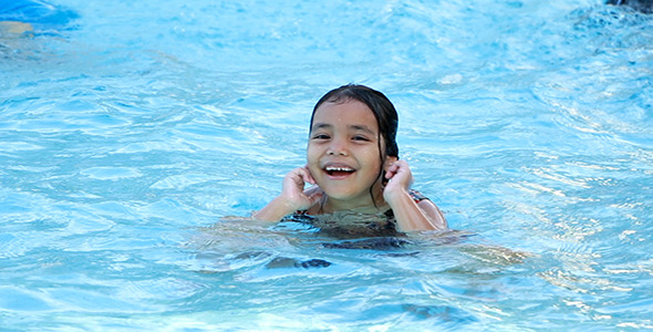 Beautiful Girl in Swimming Pool