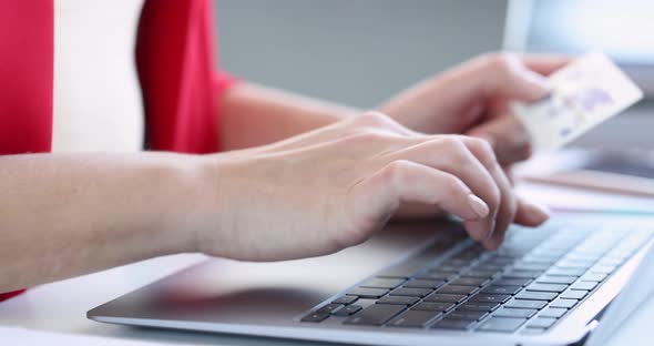 Woman Enters Details of Bank Credit Card on Computer Keyboard  Movie