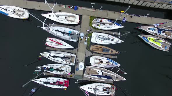 Moored yachts on the pier before the start of the sailing