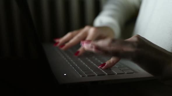 close up on the hand of young woman tapping keyboard computer