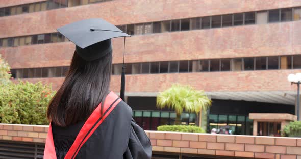 Cheerful asian woman get graduation 