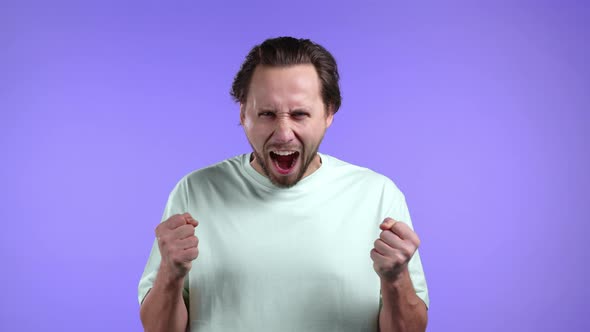 Man in Rage on Violet Background