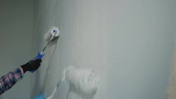 Two Person Paint the Wall with Painting Rollers alt