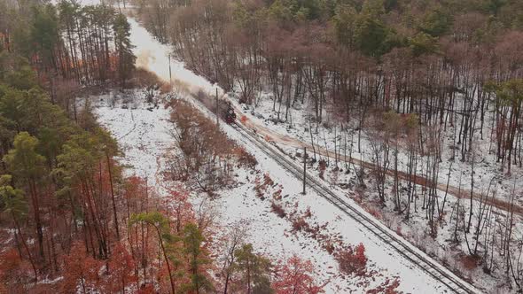 Aerial of an Antique Restored Steam Locomotive Blowing Smoke Steam Traveling