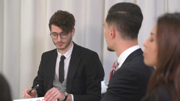 Business people talking at a meeting