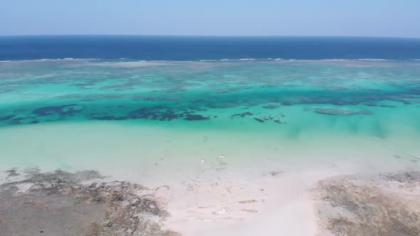 Paradise Tropical Shore and Barrier Reef in Ocean Sandbanks Zanzibar Aerial View