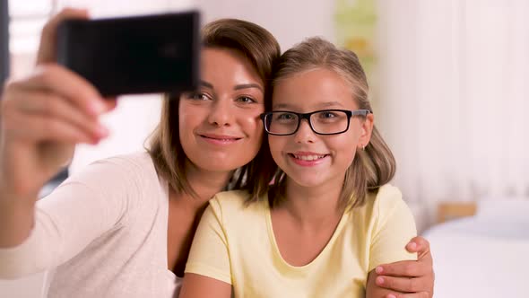 Happy Family Taking Selfie By Smartphone at Home 23