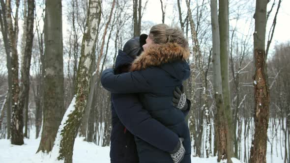 Happy Guy Twists Girlfriend in Arms