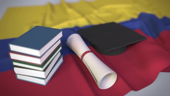 Graduation Cap and Diploma on the Flag of Colombia alt