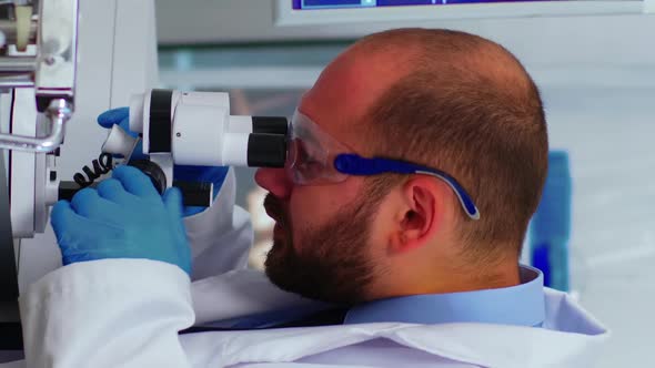 Vertical Video Biological Technology Scientist Using Microscope Doing Research